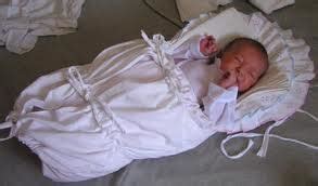 Ilustrácia novorodenca v perinke