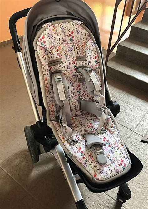 Detail rukoväte a košíka kočíka